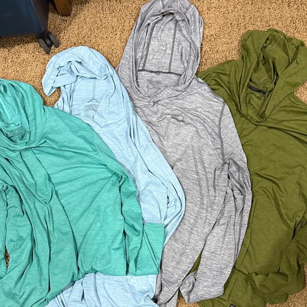Four Patagonia Men's Hoodies in Green, Blue, and Gray